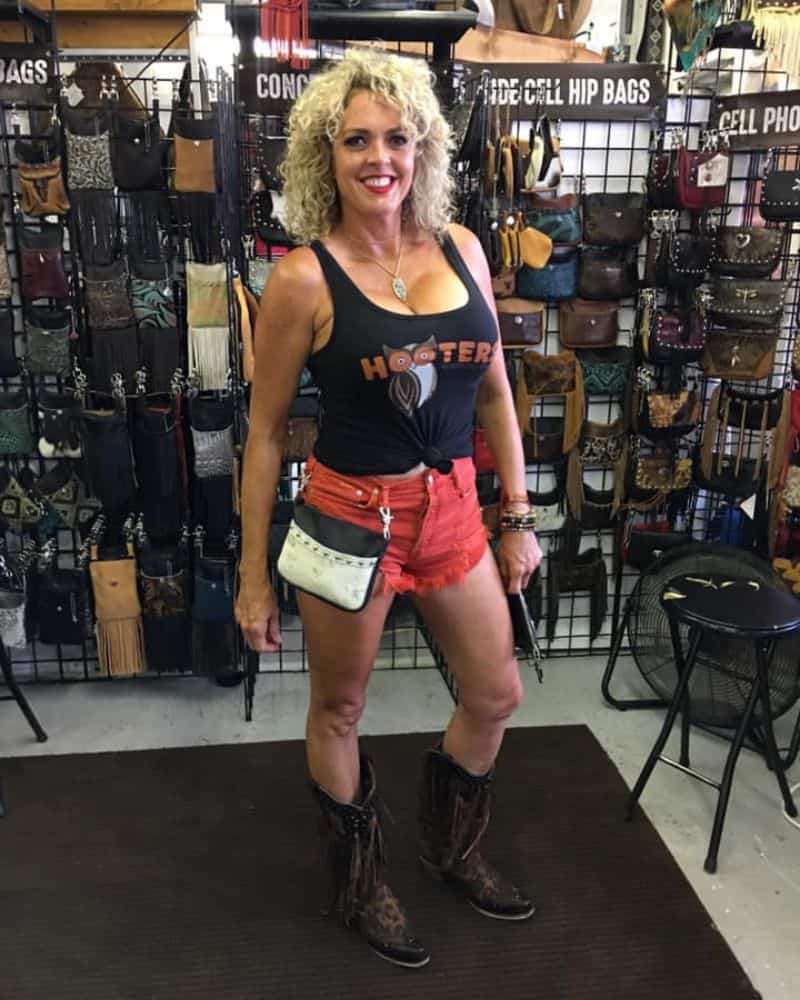hip bags at sturgis lady with hooter shirt wearing her side cell